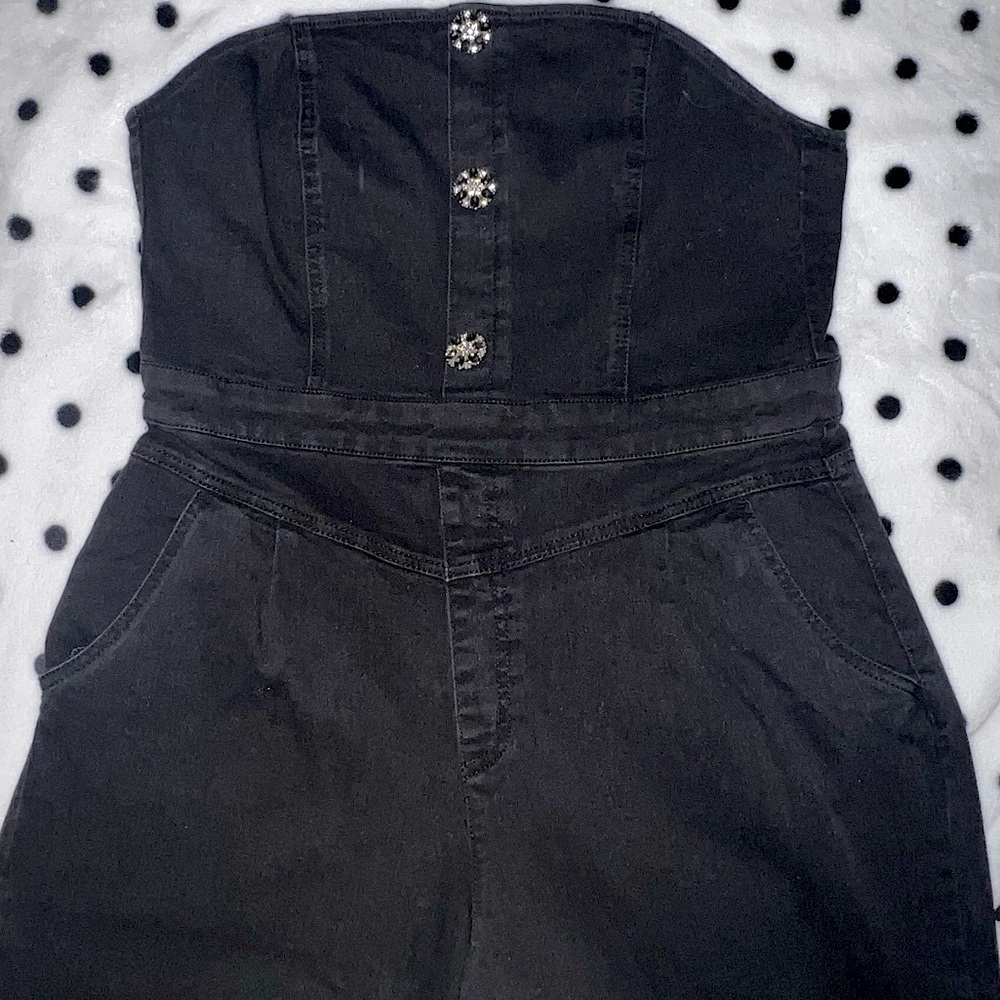 Black denim strapless romper.